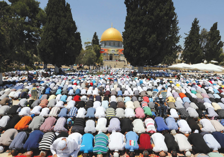 MUSLIMS PRAY next to Al-Aqsa Mosque in Jerusalem. Photo By: REUTERS MUSLIMS PRAY next to Al-Aqsa Mosque in Jerusalem.