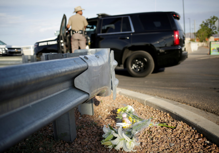 Flowers are seen at the site of a mass shooting where 20 people lost their lives at a Walmart in El Paso, Texas, U.S. August 4, 2019 Photo By: REUTERS/JOSE LUIS GONZALEZ Flowers are seen at the site of a mass shooting where 20 people lost their lives at a Walmart in El