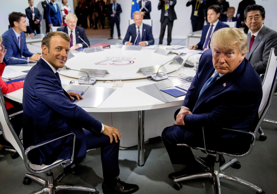 French President Emmanuel Macron and President Donald Trump participate in a G-7 Working Session on the Global Economy, Foreign Policy, and Security Affairs at the G-7 summit with German Chancellor Angela Merkel, Canadian Prime Minister Justin Trudeau and President of the European Council Donald Tus Photo By: ANDREW HARNIK/POOL VIA REUTERS French President Emmanuel Macron and President Donald Trump participate in a G-7 Working Session on