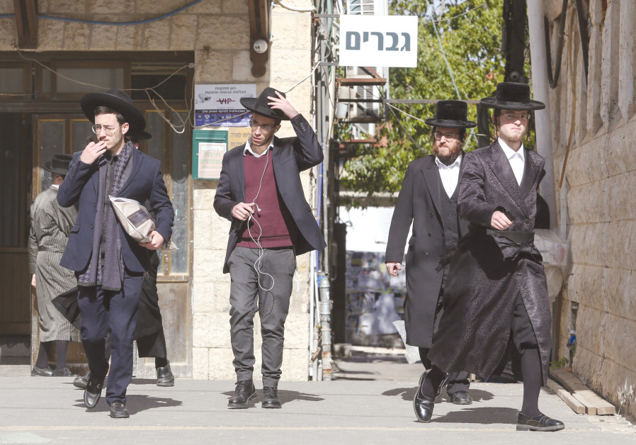 HAREDIM WALK in Jerusalem in front of a ‘Men Only’ sign – the role of religion in public life will likely increase due to demographic trends and the high birth rate in the haredi and national-religious sectors. Photo By: MARC ISRAEL SELLEM/THE JERUSALEM POST HAREDIM WALK in Jerusalem in front of a ‘Men Only’ sign – the role of religion in public life will l