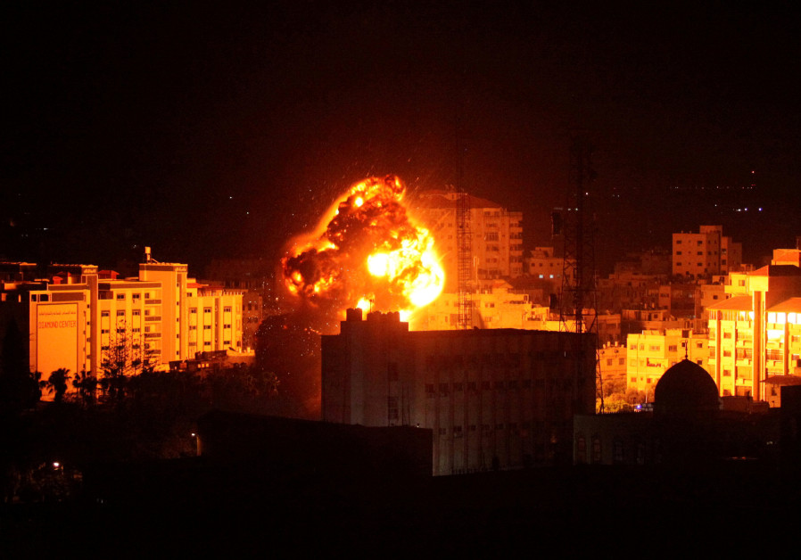 Flame and smoke are seen during an Israeli air strike in Gaza City March 25, 2019 Photo By: MOHAMMED AJOUR/REUTERS Flame and smoke are seen during an Israeli air strike in Gaza City March 25, 2019