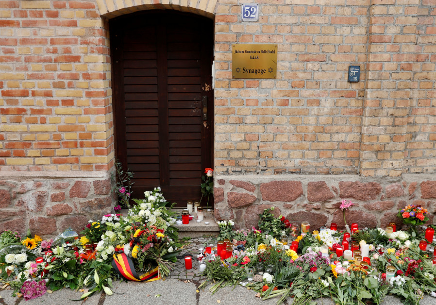 Flowers and candles are seen outside the synagogue in Halle, Germany October 10, 2019, after two people were killed in a shooting Photo By: REUTERS/FABRIZIO BENSCH Are European Jews afraid? Should they be?