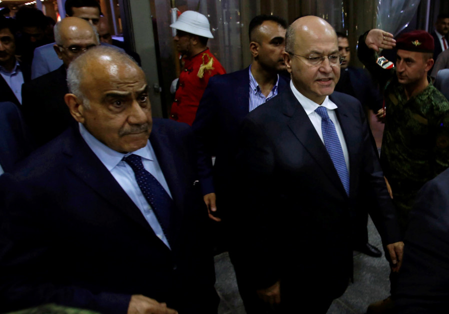 Barham Salih, Iraq's newly elected president, walks with Iraq's new Prime Minister Adel Abdul Mahdi at the parliament headquarters, in Baghdad, Iraq October 2, 2018. Photo By: REUTERS/KHALID AL MOUSILY Barham Salih, Iraq's newly elected president, walks with Iraq's new Prime Minister Adel Abdul Mahdi