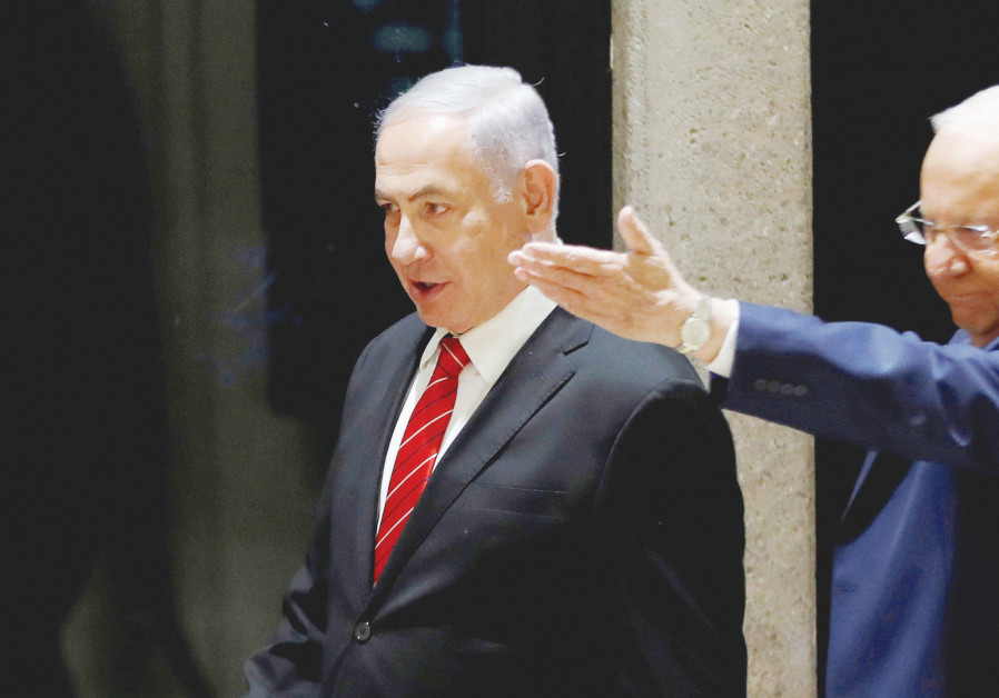 PRESIDENT REUVEN RIVLIN gestures to Prime Minister Benjamin Netanyahu at the President’s Residence on Wednesday. Photo By: REUTERS PRESIDENT REUVEN RIVLIN gestures to Prime Minister Benjamin Netanyahu at the President’s Residence o