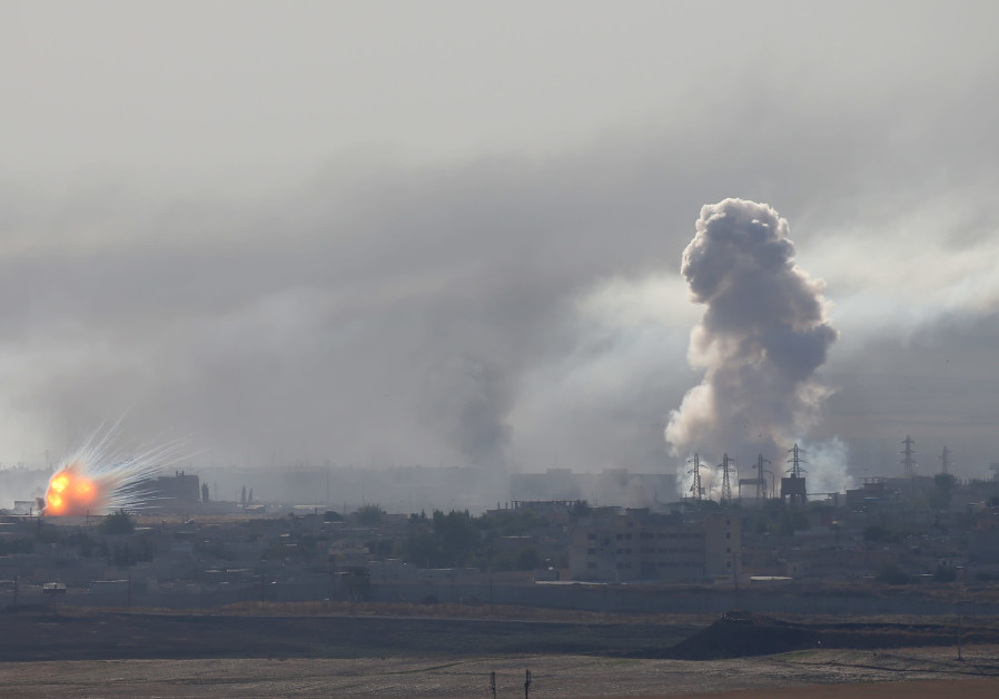 An explosion and smoke are seen over the Syrian town of Ras al-Ain as seen from the Turkish border town of Ceylanpinar, Sanliurfa province, Turkey, October 12, 2019 Photo By: REUTERS/STOYAN NENOV U.S. once stopped ethnic cleansing, now it excuses it in Syria - Analysis