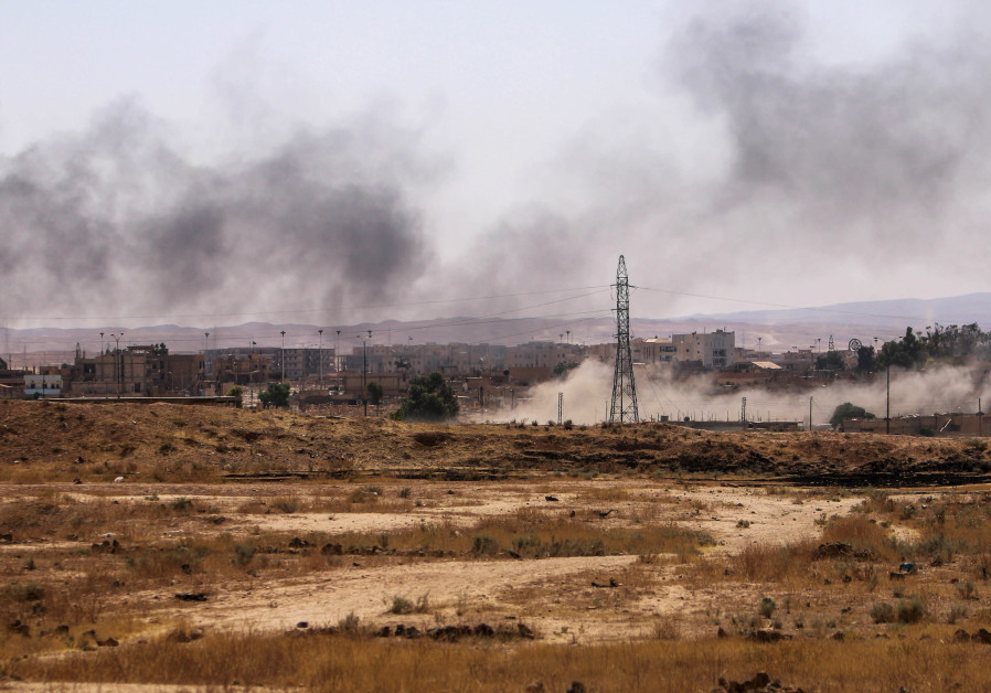 Smoke rises after what Kurdish People's Protection Units (YPG) fighters said was shelling by them on locations controlled by Islamic State fighters in Ghwayran neighborhood in Hasaka city, Syria July 22, 2015. A Syrian Kurdish militia said on Monday it was in near full control of the northeastern ci Photo By: REUTERS/RODI SAID U.S. policy on Syria unravels as Turkish ceasefire doesn't hold
