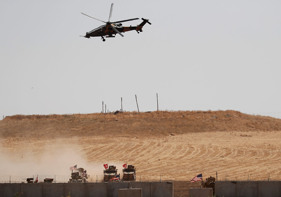 A Turkish military helicopter flies over as Turkish and U.S. troops return from a joint U.S.-Turkey patrol in northern Syria, as it is pictured from near the Turkish town of Akcakale, Turkey, September 8, 2019 Photo By: REUTERS/MURAD SEZER A Turkish military helicopter flies over as Turkish and U.S. troops return from a joint U.S.-Turkey