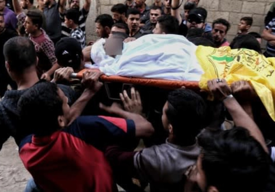 Palestinians attend mass funeral of 27 year old Ahmed Mohammed a-Shakhri, killed during Israeli airstrikes Photo By: ARAB MEDIA High alert in Israeli south as Palestinians attend mass funeral, protests