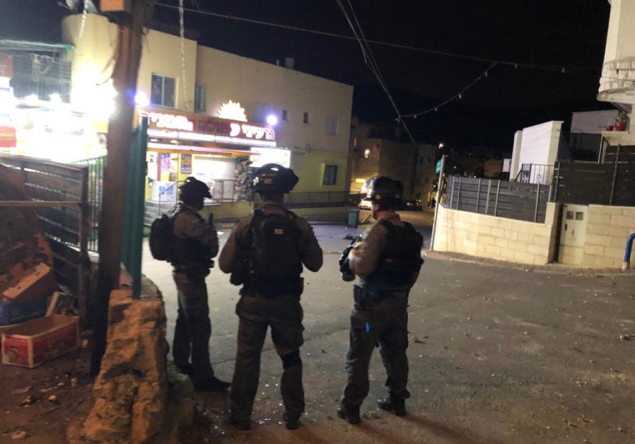 Police investigate one person's death and two people's injuries in the Turan settlement in the lower Galilee. Photo By: POLICE SPOKESPERSON'S UNIT Police investigate one person's death and two people's injuries in the Turan settlement.
