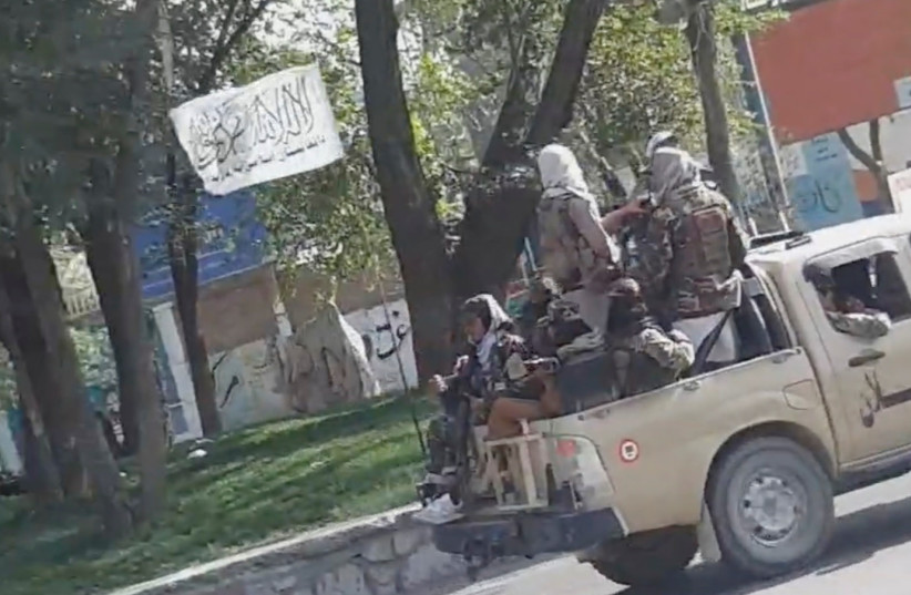 Taliban waving a flag drive through the streets of Kabul, Afghanistan August 16, 2021 in this still image taken from social media video. (credit: SNAPCHAT/ @ mr_khaludi /VIA REUTERS) Taliban waving a flag drive through the streets of Kabul, Afghanistan August 16, 2021 in this still image taken from social media video. (credit: SNAPCHAT/ @ mr_khaludi /VIA REUTERS)