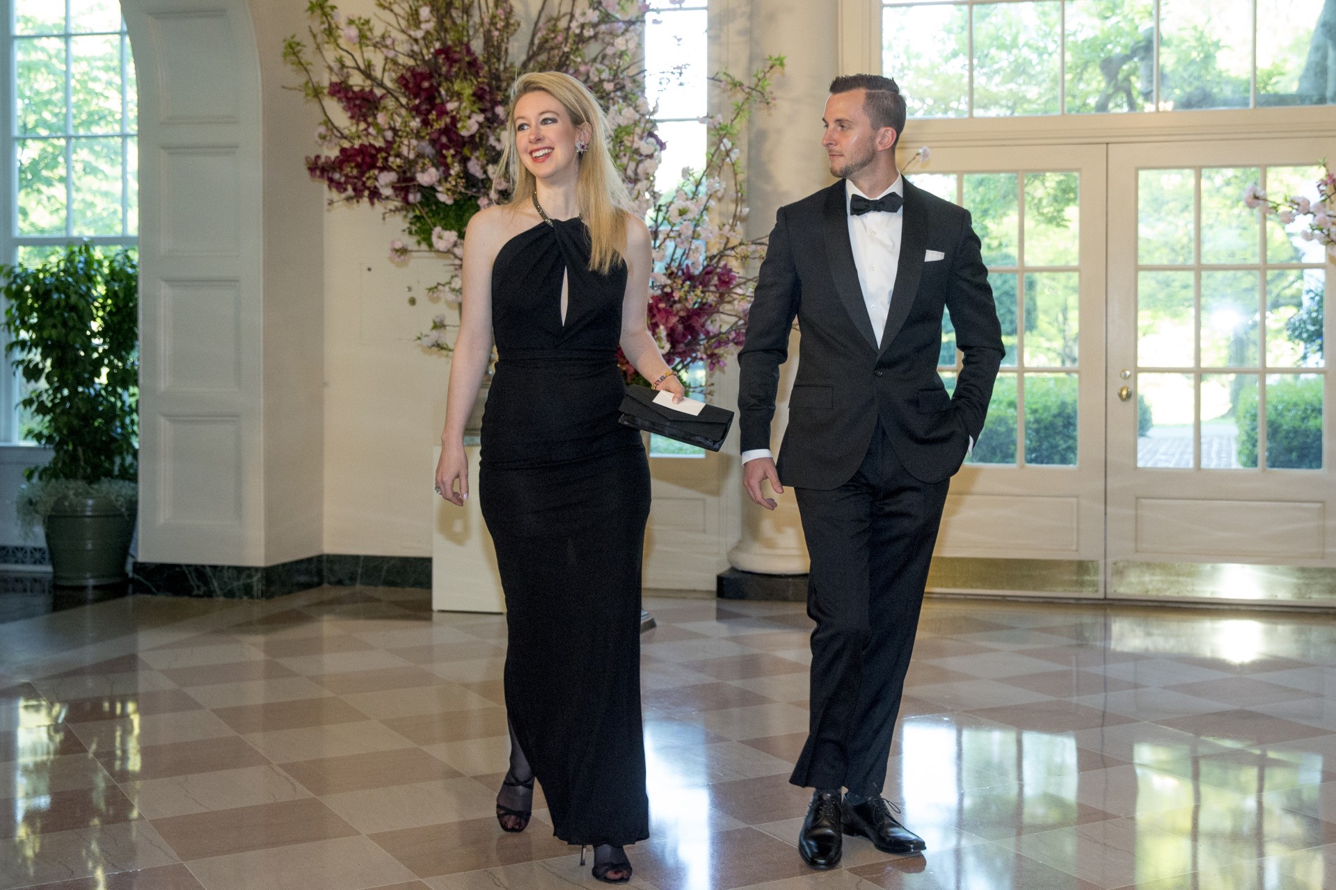 Theranos Inc. Founder and CEO Elizabeth Holmes, left, and Christian Holmes arrive for a state dinner for Japanese Prime Minister Shinzo Abe, Tuesday, April 28, 2015, at the White House in Washington. (AP Photo/Andrew Harnik)