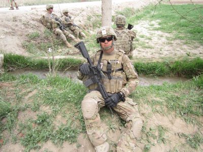 Eric Roberson on patrol in the small Afghan village of Sar-e-Sang, where he met a young soldier who reminded him of his daughter. She was the youngest member of a female engagement team. Photo courtesy of the author.