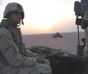Sean Paul sits in a Humvee just after crossing the border into Iraq in 2003. Photo courtesy of the author.