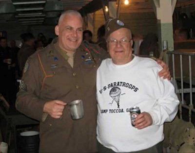 John Primerano, right, stands with William McCarthy at a Battle of the Bulge Commemorative Reenactment in Fort Indiantown Gap, Pennsylvania. Photo courtesy of Easy506th.org.