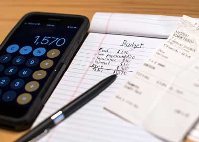 Advisers help service members manage their budgets. Salaries are low for those just starting out in the military; base pay is about $20,000. Service members hoping to start a budget can contact their local Airmen and Family Readiness Center for a one-on-one meeting. Photo illustration by Staff Sgt. Kirby Turbak, courtesy of the U.S. Air Force.