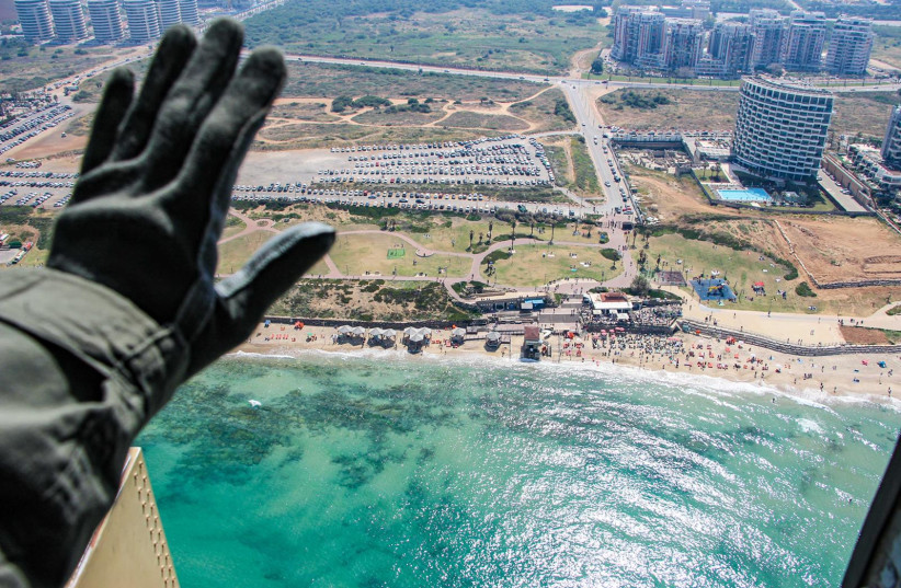 An Israeli Air Force pilot waves from his plane during the Independence Day flyover. (credit: IDF SPOKESPERSON'S UNIT) An Israeli Air Force pilot waves from his plane during the Independence Day flyover. (credit: IDF SPOKESPERSON'S UNIT)