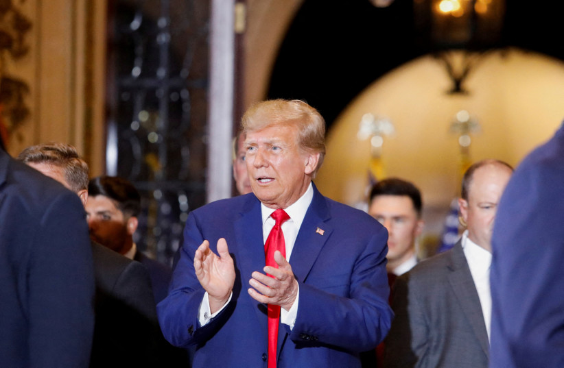 Former U.S. President Donald Trump walks, ahead of delivering remarks on the day of his court appearance in New York after being indicted by a Manhattan grand jury following a probe into hush money paid to porn star Stormy Daniels, in Palm Beach, Florida, U.S., April 4, 2023 (credit: REUTERS/MARCO BELLO) Former U.S. President Donald Trump walks, ahead of delivering remarks on the day of his court appearance in New York after being indicted by a Manhattan grand jury following a probe into hush money paid to porn star Stormy Daniels, in Palm Beach, Florida, U.S., April 4, 2023 (credit: REUTERS/MARCO BELLO)