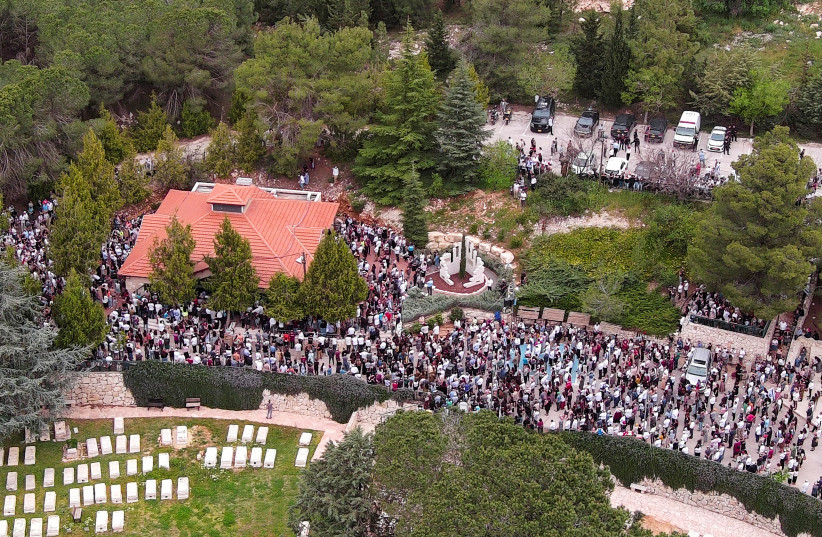 An aerial view shows friends and family of Maia and Rina Dee, Israeli-British sisters killed in a shooting attack, as they attend their funerals at a cemetery in Kfar Etzion in the West Bank, April 9, 2023. (credit: ILAN ROSENBERG/REUTERS) An aerial view shows friends and family of Maia and Rina Dee, Israeli-British sisters killed in a shooting attack, as they attend their funerals at a cemetery in Kfar Etzion in the West Bank, April 9, 2023. (credit: ILAN ROSENBERG/REUTERS)