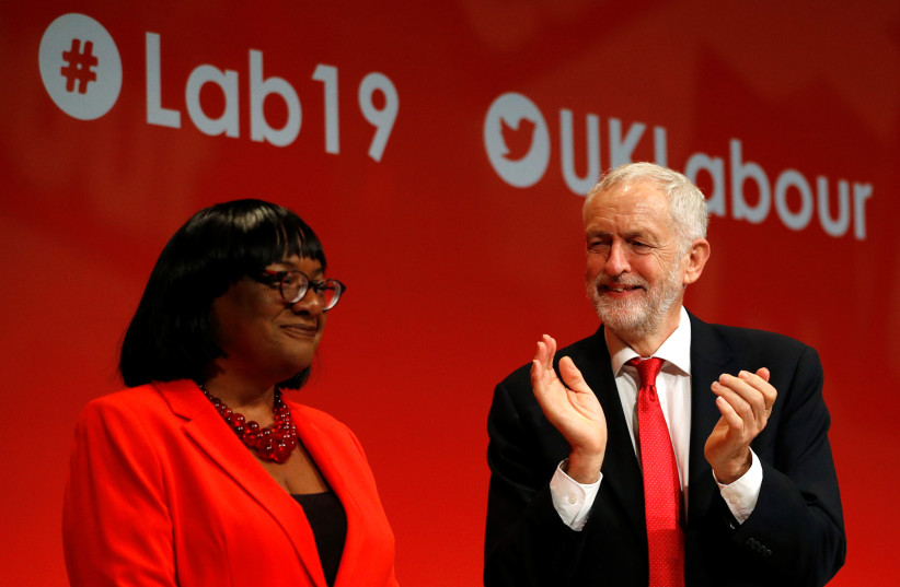 Britain's Labour party leader Jeremy Corbyn applauds after the speech of Labour party MP and Shadow Home Secretary Diane Abbott during the Labour Party annual conference in Brighton, Britain September 22, 2019. (credit: PETER NICHOLLS/REUTERS) Britain's Labour party leader Jeremy Corbyn applauds after the speech of Labour party MP and Shadow Home Secretary Diane Abbott during the Labour Party annual conference in Brighton, Britain September 22, 2019. (credit: PETER NICHOLLS/REUTERS)