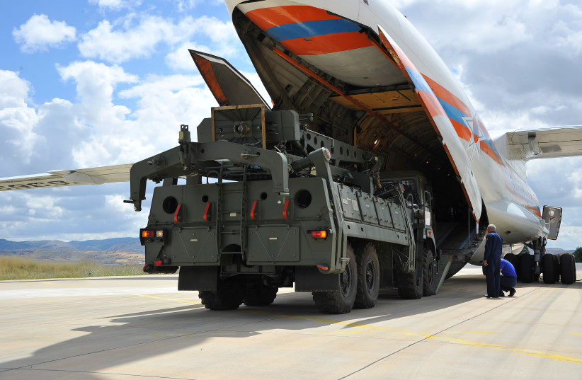 First parts of a Russian S-400 missile defense system are unloaded from a Russian plane at Murted Airport, known as Akinci Air Base, near Ankara, Turkey, July 12, 2019. (credit: REUTERS) First parts of a Russian S-400 missile defense system are unloaded from a Russian plane at Murted Airport, known as Akinci Air Base, near Ankara, Turkey, July 12, 2019. (credit: REUTERS)