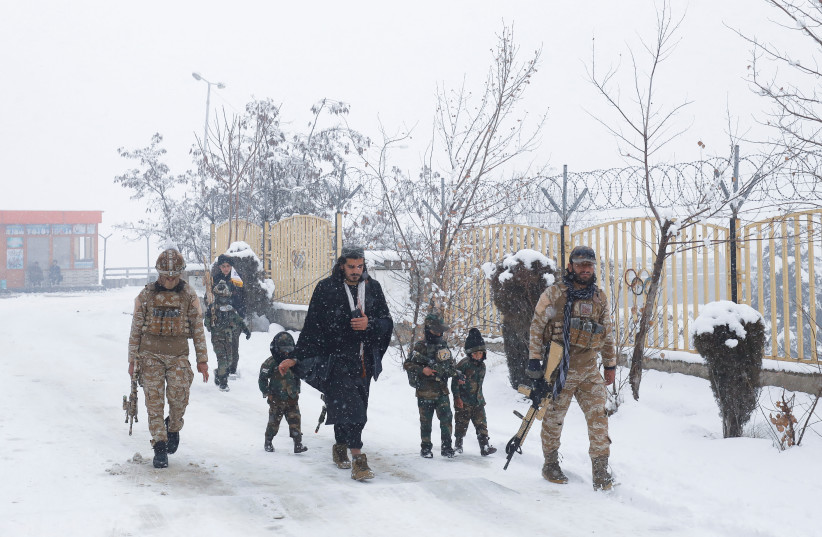 Taliban soldiers with their children dressed in military uniforms and holding plastic weapons, walk on a snow-covered street on a snowy day in Kabul, Afghanistan, January 29, 2023. (credit: ALI KHARA/REUTERS) Taliban soldiers with their children dressed in military uniforms and holding plastic weapons, walk on a snow-covered street on a snowy day in Kabul, Afghanistan, January 29, 2023. (credit: ALI KHARA/REUTERS)