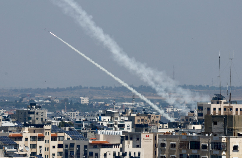 Rockets are fired from Gaza into Israel, in Gaza on May 10, 2023. (credit: MOHAMMED SALEM/REUTERS) Rockets are fired from Gaza into Israel, in Gaza on May 10, 2023. (credit: MOHAMMED SALEM/REUTERS)