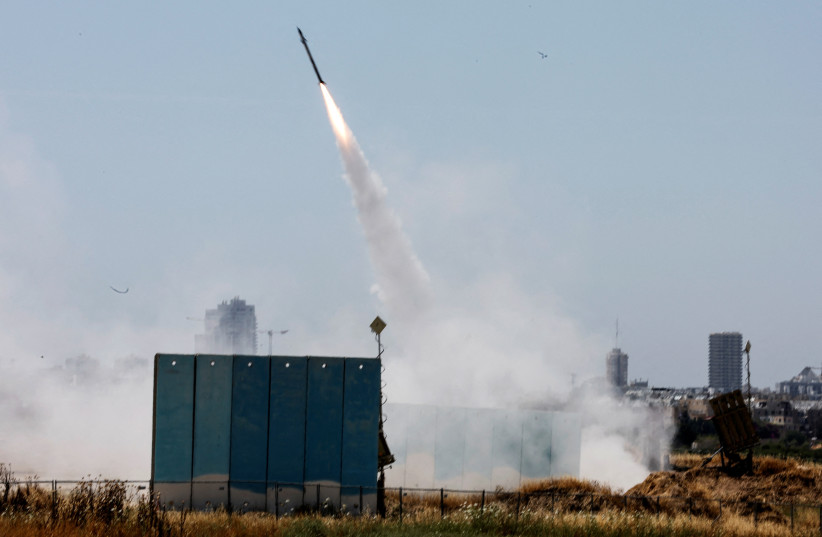 An Israeli Iron Dome anti-missile system is activated as rockets launched from the Gaza Strip, near Ashdod, Israel May 10, 2023 (credit: REUTERS/AMMAR AWAD) An Israeli Iron Dome anti-missile system is activated as rockets launched from the Gaza Strip, near Ashdod, Israel May 10, 2023 (credit: REUTERS/AMMAR AWAD)