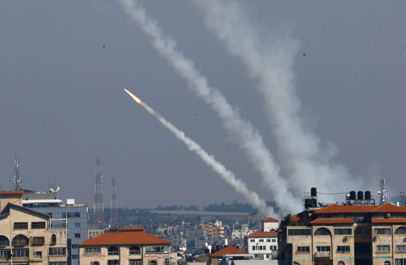 Rockets are fired from Gaza into Israel, in Gaza May 10, 2023 (credit: REUTERS/AMMAR AWAD) Rockets are fired from Gaza into Israel, in Gaza May 10, 2023 (credit: REUTERS/AMMAR AWAD)