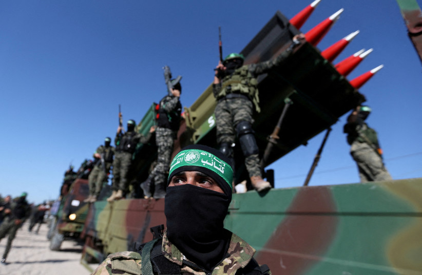 Palestinian Hamas terrorists attend an anti-Israel rally in Khan Younis, in the southern Gaza Strip May 27, 2021 (credit: REUTERS/IBRAHEEM ABU MUSTAFA) Palestinian Hamas terrorists attend an anti-Israel rally in Khan Younis, in the southern Gaza Strip May 27, 2021 (credit: REUTERS/IBRAHEEM ABU MUSTAFA)