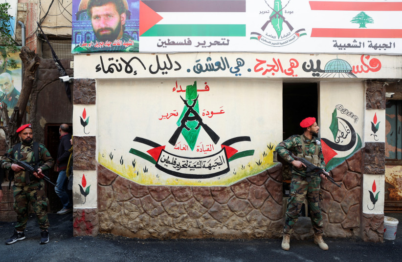 Members of the Popular Front for the Liberation of Palestine-General Command (PFLP-GC) stand guard during a parade marking the annual al-Quds Day, (Jerusalem Day), at Burj al-Barajneh Palestinian refugee camp in Beirut, Lebanon April 14, 2023. (credit: REUTERS/MOHAMED AZAKIR) Members of the Popular Front for the Liberation of Palestine-General Command (PFLP-GC) stand guard during a parade marking the annual al-Quds Day, (Jerusalem Day), at Burj al-Barajneh Palestinian refugee camp in Beirut, Lebanon April 14, 2023. (credit: REUTERS/MOHAMED AZAKIR)
