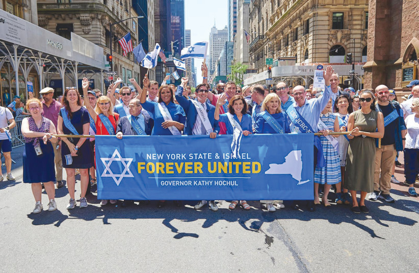 PARTICIPANTS AT the Celebrate Israel Parade include the author, the grand marshal of the event, at the front and center flanked by the governor of the State of New York Kathy Hochul to the immediate right and state Attorney-General Letitia James to the immediate left. (credit: PERRY BINDELGLASS) PARTICIPANTS AT the Celebrate Israel Parade include the author, the grand marshal of the event, at the front and center flanked by the governor of the State of New York Kathy Hochul to the immediate right and state Attorney-General Letitia James to the immediate left. (credit: PERRY BINDELGLASS)