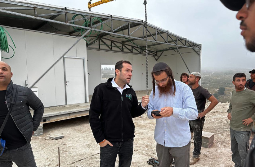 Students build the new Homesh Yeshiva building in northern Samaria. (credit: ROI HADI) Students build the new Homesh Yeshiva building in northern Samaria. (credit: ROI HADI)