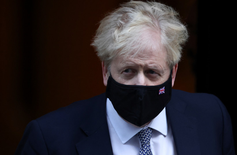 British Prime Minister Boris Johnson walks outside Downing Street in London, Britain, January 12, 2022. (credit: REUTERS/HENRY NICHOLLS) British Prime Minister Boris Johnson walks outside Downing Street in London, Britain, January 12, 2022. (credit: REUTERS/HENRY NICHOLLS)