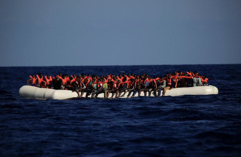 An overcrowded dinghy with migrants from different African countries is seen during a rescue operation off the Libyan coast in the Mediterranean Sea September 21, 2016. (credit: REUTERS) An overcrowded dinghy with migrants from different African countries is seen during a rescue operation off the Libyan coast in the Mediterranean Sea September 21, 2016. (credit: REUTERS)