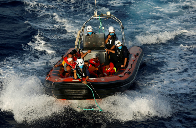 A RHIB (rigid hulled inflatable boat) from the German NGO migrant rescue ship Sea-Watch 3 returns to the ship after rescuing twelve migrants from a wooden boat in international waters north of Libya, in the western Mediterranean Sea, August 2, 2021. (credit: DARRIN ZAMMIT LUPI/REUTERS) A RHIB (rigid hulled inflatable boat) from the German NGO migrant rescue ship Sea-Watch 3 returns to the ship after rescuing twelve migrants from a wooden boat in international waters north of Libya, in the western Mediterranean Sea, August 2, 2021. (credit: DARRIN ZAMMIT LUPI/REUTERS)