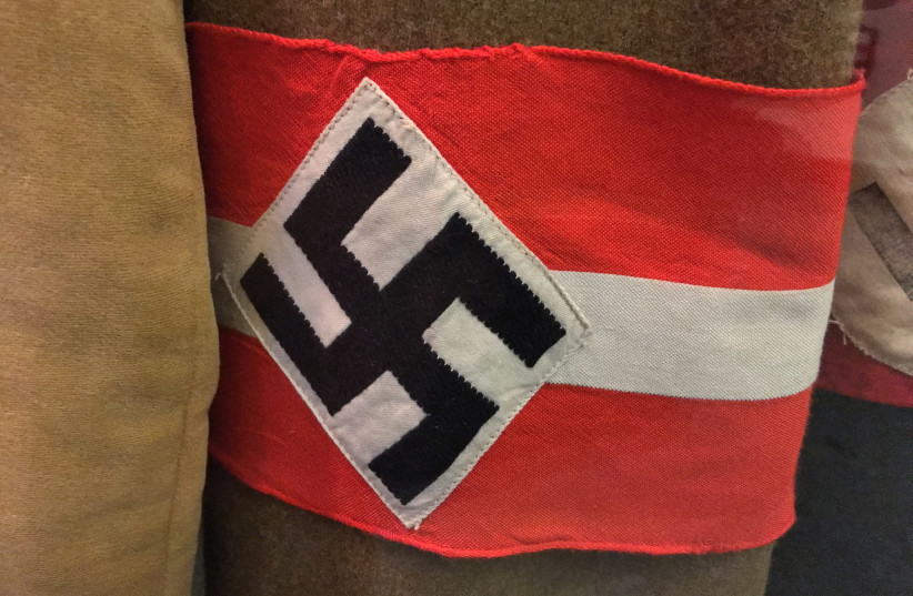 A Nazi armband with a swastika displayed in the Deutsches Historisches Museum, Berlin, Germany (credit: Wikimedia Commons) A Nazi armband with a swastika displayed in the Deutsches Historisches Museum, Berlin, Germany (credit: Wikimedia Commons)