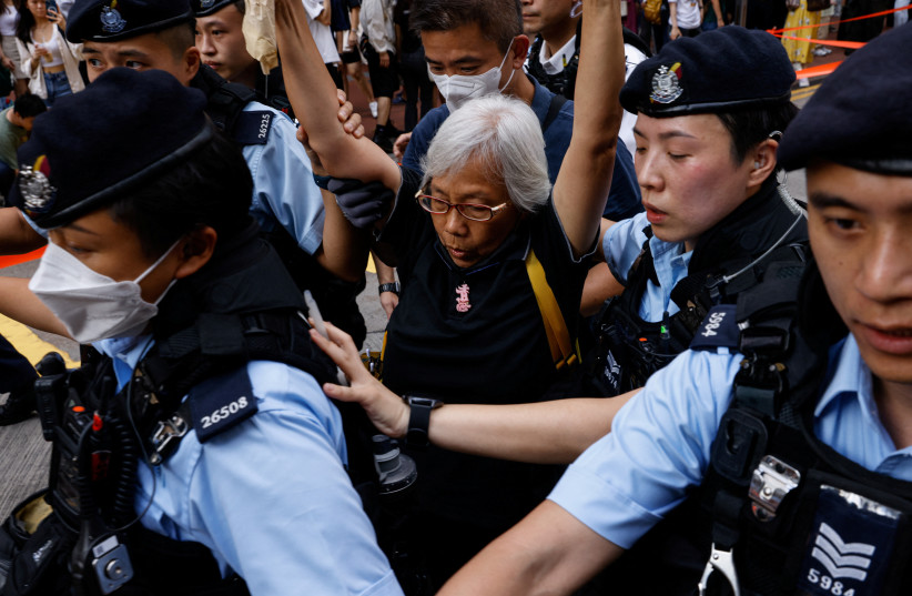 Police detain a woman in downtown on the 34th anniversary of the 1989 Beijing's Tiananmen Square crackdown, near where the candlelight vigil is usually held, in Hong Kong, China June 4, 2023. (credit: TYRONE SIU/ REUTERS) Police detain a woman in downtown on the 34th anniversary of the 1989 Beijing's Tiananmen Square crackdown, near where the candlelight vigil is usually held, in Hong Kong, China June 4, 2023. (credit: TYRONE SIU/ REUTERS)