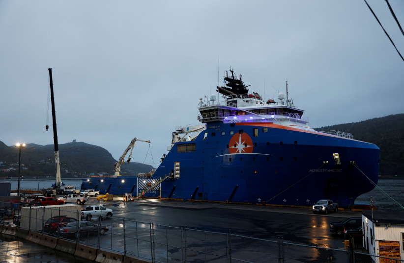 Equipment that was flown in by U.S. Air Force transport planes is loaded onto the offshore vessel Horizon Arctic, before its deployment to the search area of a missing OceanGate Expeditions submersible which had been carrying five people to explore the sunken Titanic. (credit: REUTERS/DAVID HISCOCK) Equipment that was flown in by U.S. Air Force transport planes is loaded onto the offshore vessel Horizon Arctic, before its deployment to the search area of a missing OceanGate Expeditions submersible which had been carrying five people to explore the sunken Titanic. (credit: REUTERS/DAVID HISCOCK)