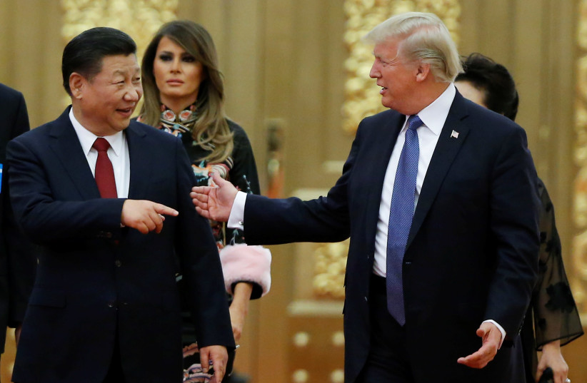 US President Donald Trump and China's President Xi Jinping arrive at state dinner, Great Hall of the People, Beijing, 2017. (credit: THOMAS PETER/REUTERS) US President Donald Trump and China's President Xi Jinping arrive at state dinner, Great Hall of the People, Beijing, 2017. (credit: THOMAS PETER/REUTERS)