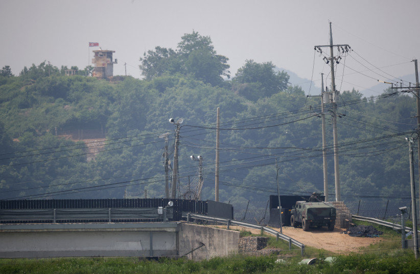 A South Korean soldier in an armoured vehicle stands guard as a North Korean guard post is seen in this picture taken near the demilitarized zone which separates the two Koreas in Paju, South Korea, May 31, 2023. (credit: KIM HONG-JI/ REUTERS) A South Korean soldier in an armoured vehicle stands guard as a North Korean guard post is seen in this picture taken near the demilitarized zone which separates the two Koreas in Paju, South Korea, May 31, 2023. (credit: KIM HONG-JI/ REUTERS)
