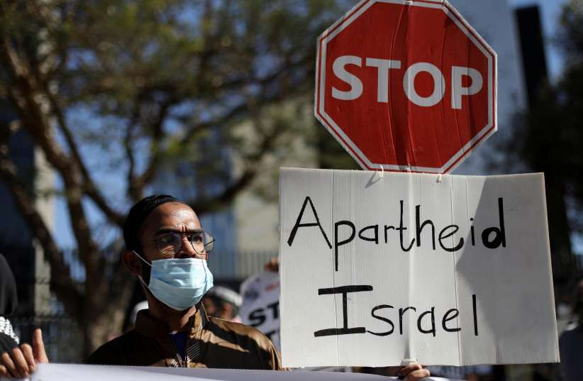 South African demonstrators and BDS activists hold placards during a protest in May 2021 outside the Israel Trade offices in Sandton, SA, following a flare-up of Israeli-Palestinian violence (credit: SIPHIWE SIBEKO/REUTERS) South African demonstrators and BDS activists hold placards during a protest in May 2021 outside the Israel Trade offices in Sandton, SA, following a flare-up of Israeli-Palestinian violence (credit: SIPHIWE SIBEKO/REUTERS)