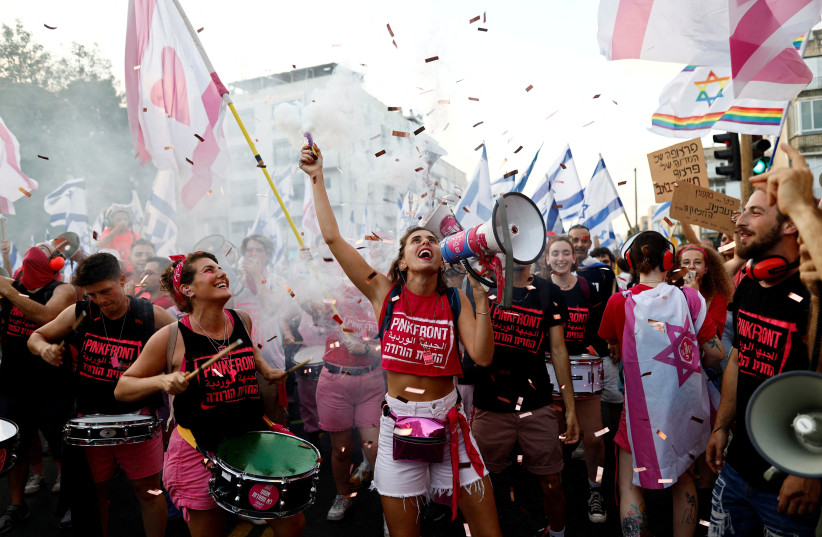 People take part in a demonstration against Israeli Prime Minister Benjamin Netanyahu and his nationalist coalition government's judicial overhaul, in Tel Aviv, Israel, July 22, 2023. (credit: REUTERS/CORINNA KERN) People take part in a demonstration against Israeli Prime Minister Benjamin Netanyahu and his nationalist coalition government's judicial overhaul, in Tel Aviv, Israel, July 22, 2023. (credit: REUTERS/CORINNA KERN)