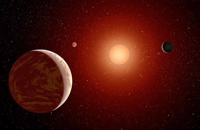Artistic illustration of planets orbiting a red dwarf star. (credit: Wikimedia Commons) Artistic illustration of planets orbiting a red dwarf star. (credit: Wikimedia Commons)