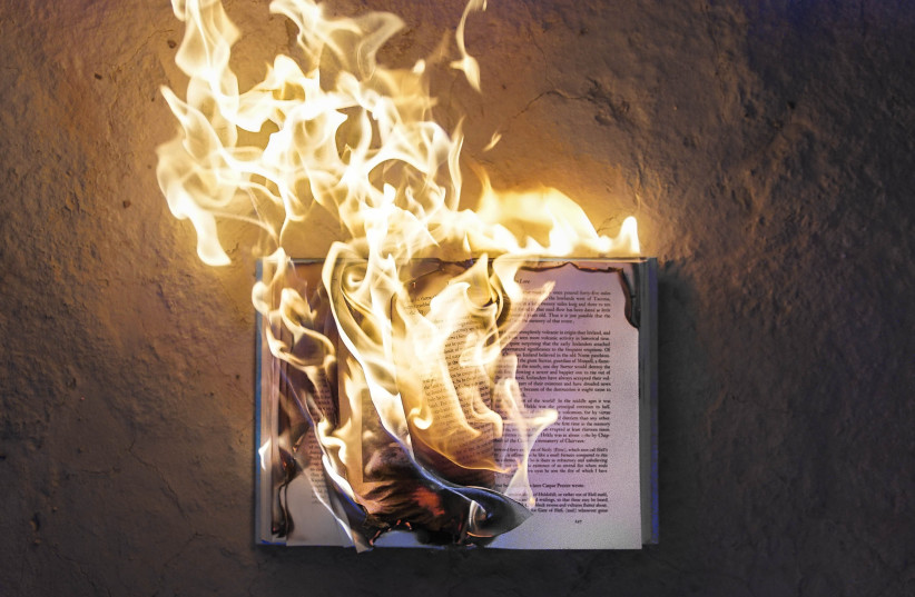 Burning books. (credit: Freddy Kearney/Unsplash) Burning books. (credit: Freddy Kearney/Unsplash)