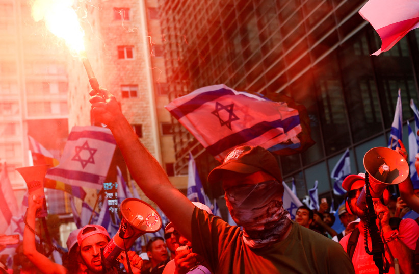 People demonstrate on the 'Day of National Resistance' in protest against Israeli Prime Minister Benjamin Netanyahu and his nationalist coalition government's judicial reform, in Tel Aviv, Israel July 18, 2023. (credit: CORINNA KERN/REUTERS) People demonstrate on the 'Day of National Resistance' in protest against Israeli Prime Minister Benjamin Netanyahu and his nationalist coalition government's judicial reform, in Tel Aviv, Israel July 18, 2023. (credit: CORINNA KERN/REUTERS)