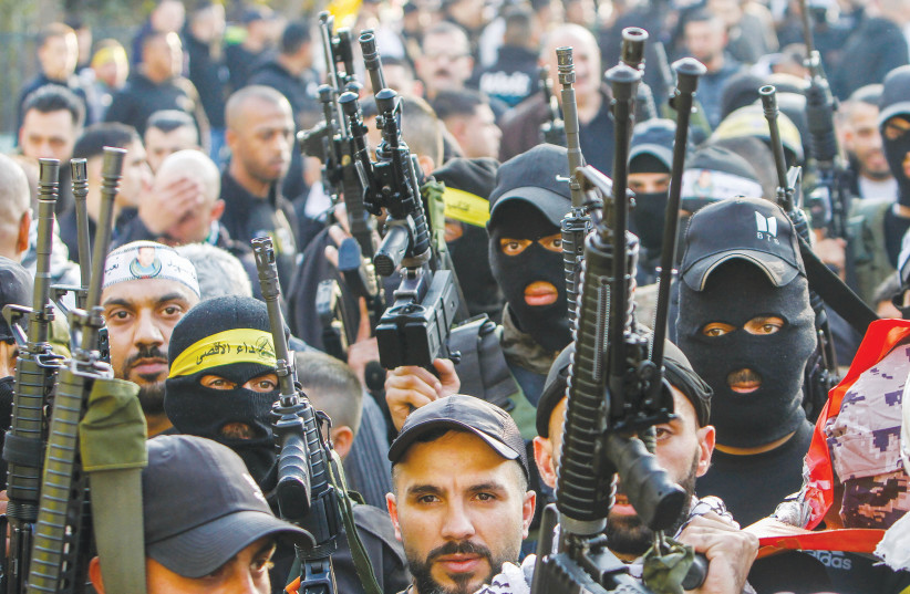 MEMBERS OF the Balata Brigade and the Lion’s Den display their weapons in Askar refugee camp in the West Bank. (credit: NASSER ISHTAYEH/FLASH90) MEMBERS OF the Balata Brigade and the Lion’s Den display their weapons in Askar refugee camp in the West Bank. (credit: NASSER ISHTAYEH/FLASH90)