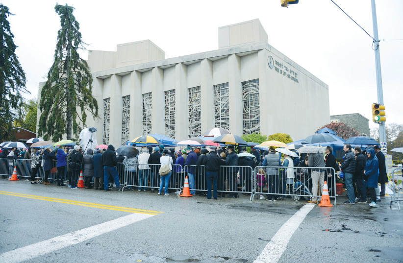 A CROWD attends a vigil outside the Tree of Life synagogue, marking one week after the deadly shooting there, in Pittsburgh, in 2018. (credit: ALAN FREED/REUTERS) A CROWD attends a vigil outside the Tree of Life synagogue, marking one week after the deadly shooting there, in Pittsburgh, in 2018. (credit: ALAN FREED/REUTERS)