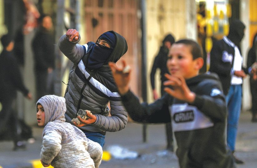 YOUNG PALESTINIANS clash with Israeli soldiers in Jenin, earlier this year. (credit: WISAM HASHLAMOUN/FLASH90) YOUNG PALESTINIANS clash with Israeli soldiers in Jenin, earlier this year. (credit: WISAM HASHLAMOUN/FLASH90)
