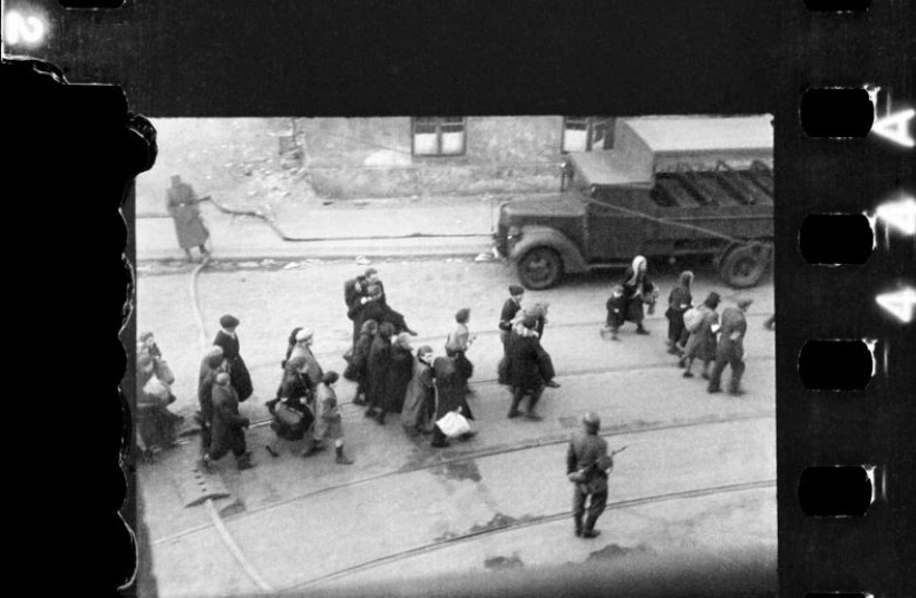 being led to Umschlagplatz; photo taken from a window of St Zofia Hospital in Warsaw. (credit: Z. L. Grzywaczewski/Family archive of Maciej Grzywaczewski/print from the negative: POLIN Museum) being led to Umschlagplatz; photo taken from a window of St Zofia Hospital in Warsaw. (credit: Z. L. Grzywaczewski/Family archive of Maciej Grzywaczewski/print from the negative: POLIN Museum)