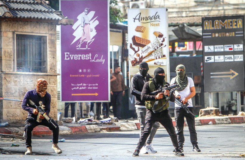 PALESTINIAN GUNMEN take to the streets of Jenin on Monday, after Israel began a military operation. (credit: NASSER ISHTAYEH/FLASH90) PALESTINIAN GUNMEN take to the streets of Jenin on Monday, after Israel began a military operation. (credit: NASSER ISHTAYEH/FLASH90)